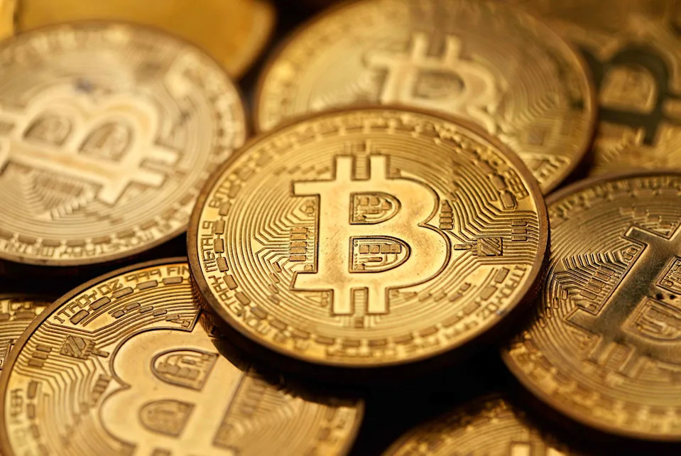 Bitcoin Drops to $77,000, Crypto Shares Slip
