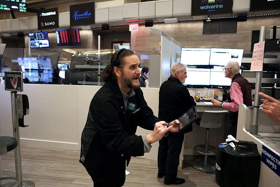 Photos show reactions at the New York Stock Exchange as Trump's tariff announcements sent markets crashing and soaring