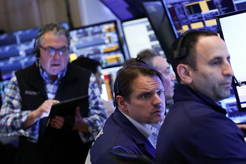 Photos show reactions at the New York Stock Exchange as Trump's tariff announcements sent markets crashing and soaring